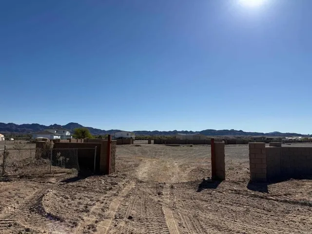Looking from property through gate to Rio Vista Way