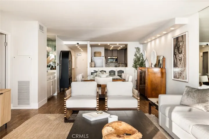 Living room, dining room and kitchen in the background