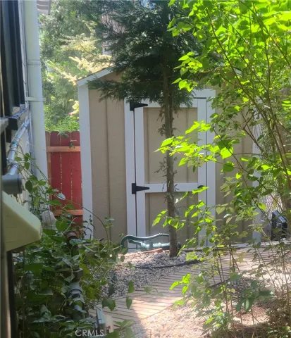 Shed with power in fenced side yard