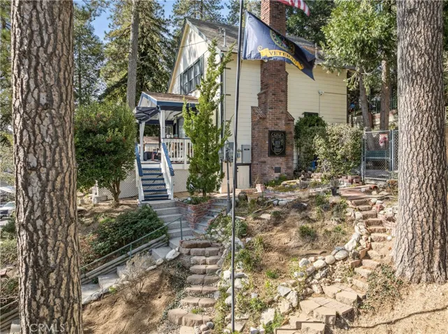 Side yard with terraced gardens & flagpole