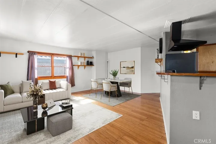 Spacious living area with wood floors