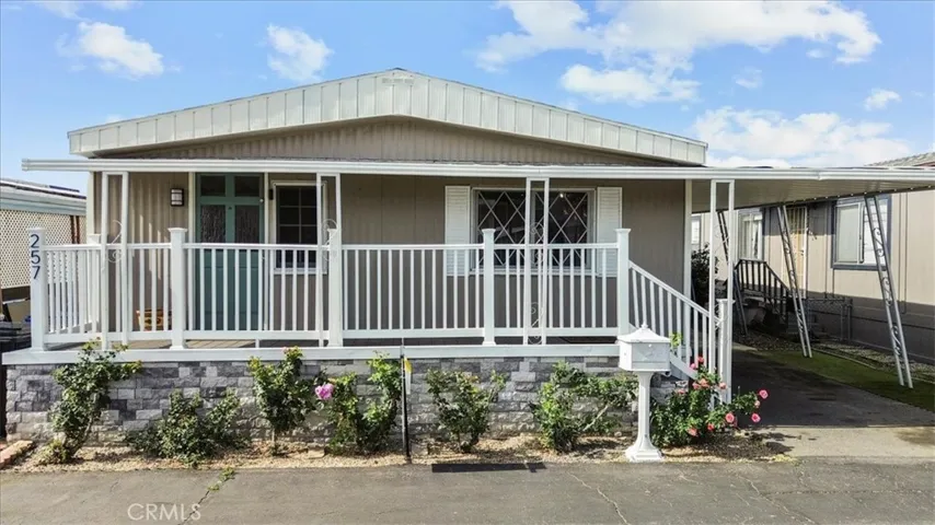 Updated Mfg home with porch & carport