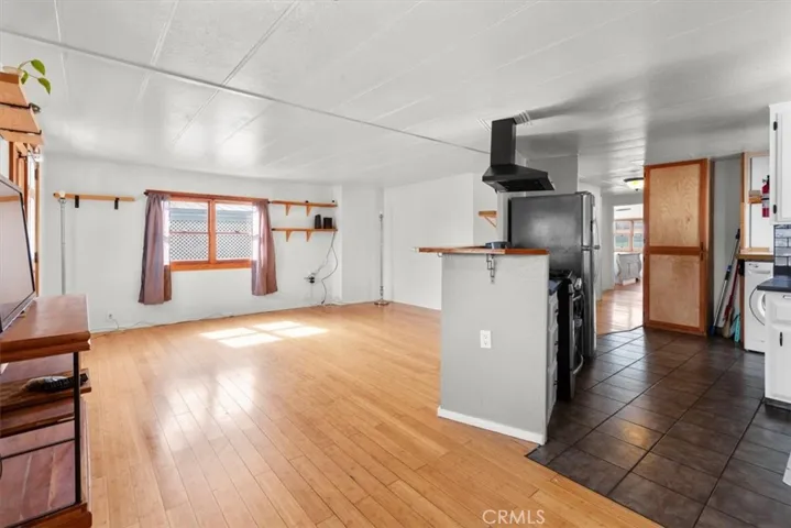 Spacious living area with wood floors
