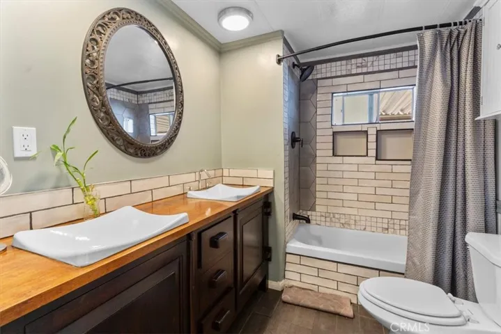 Updated bath with dual sinks and tile