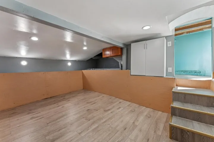 Finished basement featuring recessed lighting and light wood-style floors