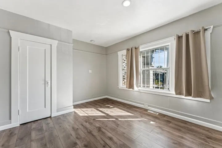 Empty room featuring wood finished floors