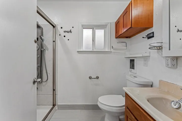 Full bathroom with a stall shower and vanity