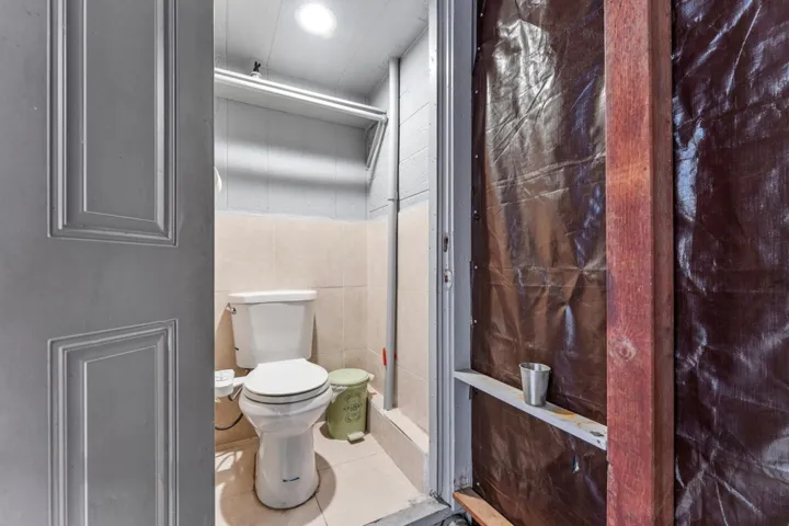Bathroom featuring tile walls and tile patterned flooring