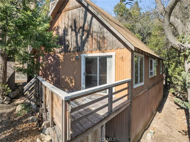 SIDE OF HOME WITH BUILDUP FOR STORAGE