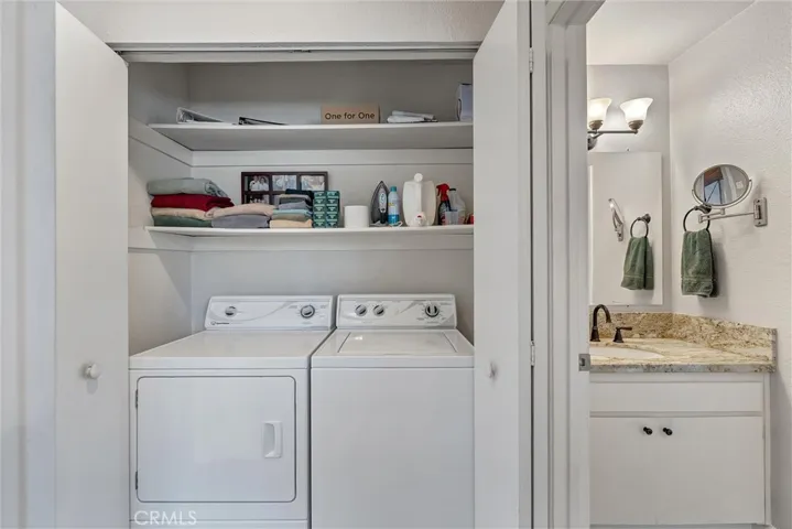 Upstairs laundry in closet