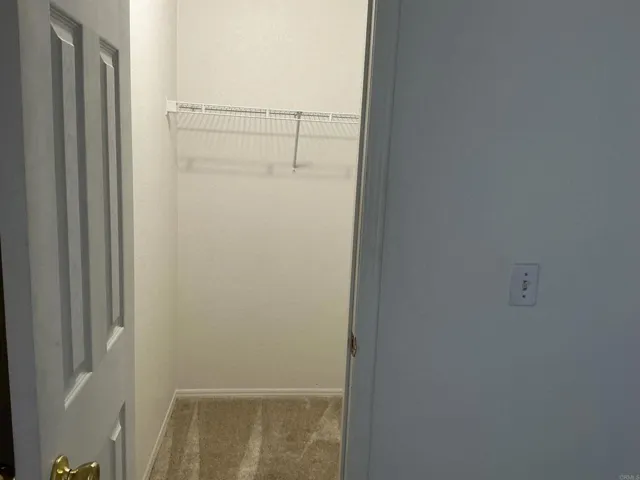 Small walk in closet in 2nd bedroom