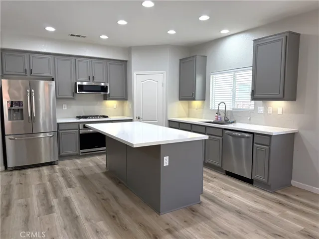 plenty of cabinetry plus walk-in pantry