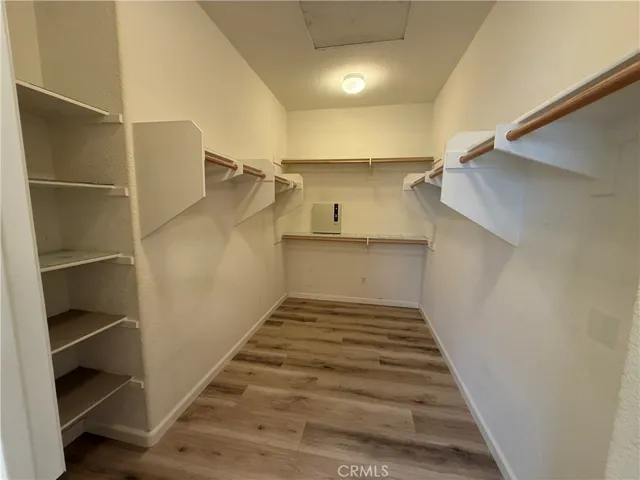 large primary bedroom walk in closet