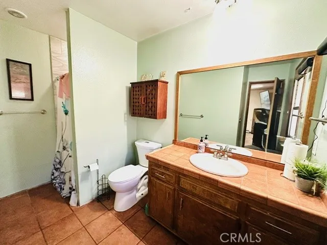 Private En-Suite Bathroom-Digitally Enhanced, person & bottles removed