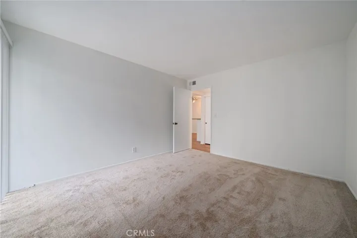 2nd bedroom, w/ walk-in closet and balcony with view
