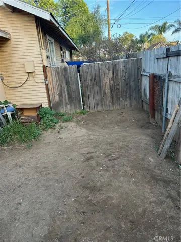 uncovered car port on south side of