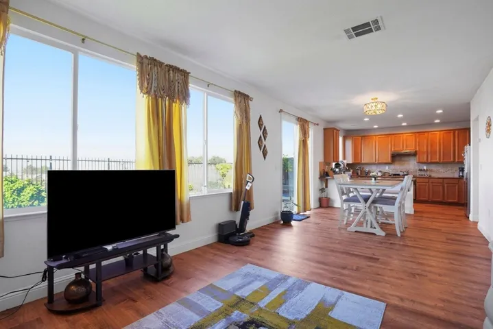 Living area featuring recessed lighting and dark wood finished floors