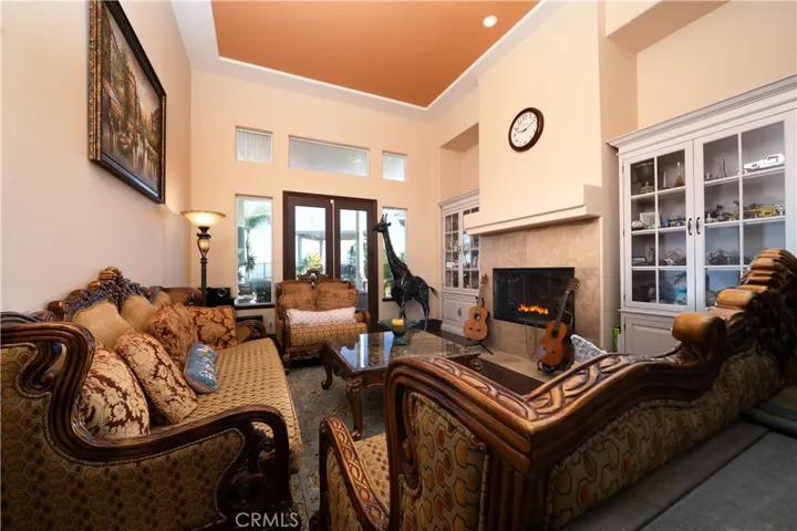 Living Room invites guests in from the main entrance and opens to the backyard