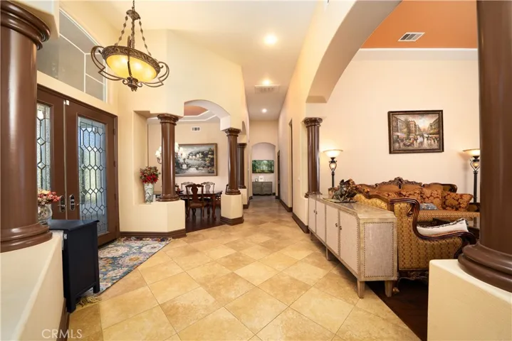 Tasteful foyer opens to Living Room, Formal Dining Room, and hallways