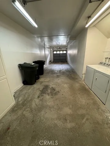 Two Car tandem Garage with storage cabinet and overhead