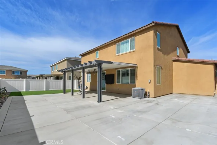 Backyard angle with large concrete pad