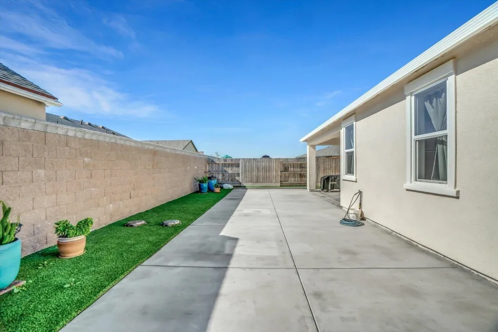 fenced backyard featuring a patio area