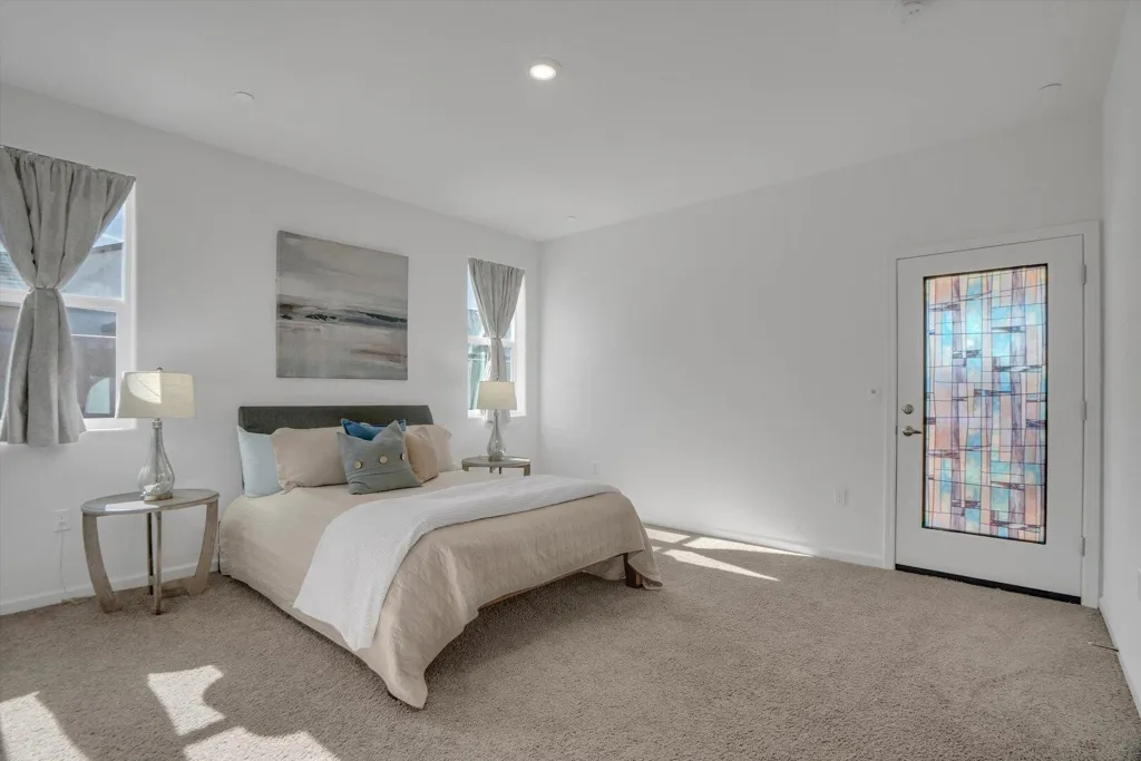 carpeted bedroom featuring baseboards and recessed lighting