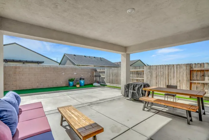 fenced backyard featuring a patio area and outdoor dining space
