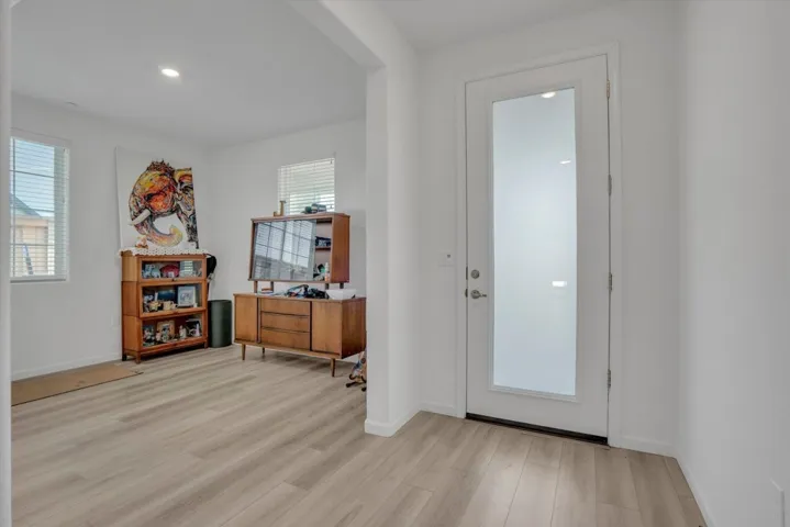 entrance foyer with light wood-style flooring and recessed lighting