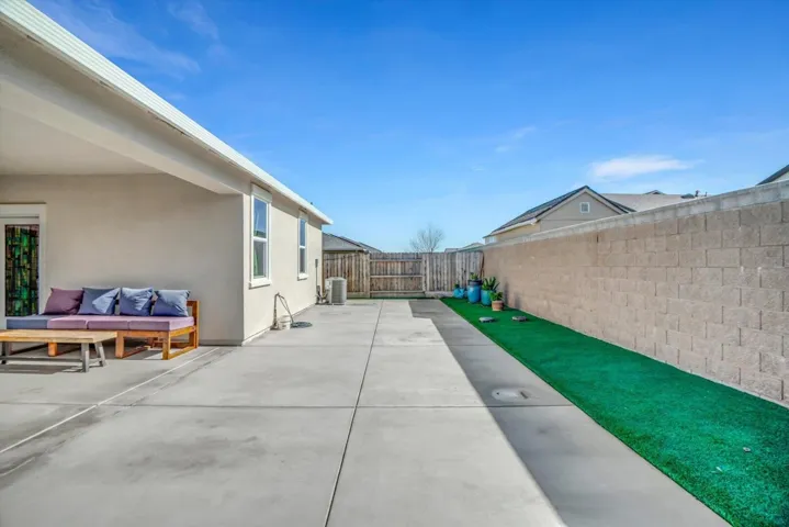 fenced backyard featuring a patio