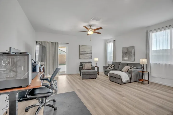 office featuring light wood-style flooring and a ceiling fan