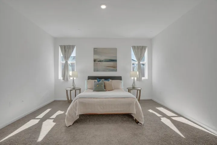 bedroom with carpet floors and recessed lighting