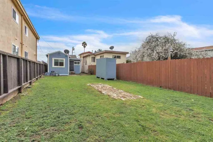 View of fenced backyard