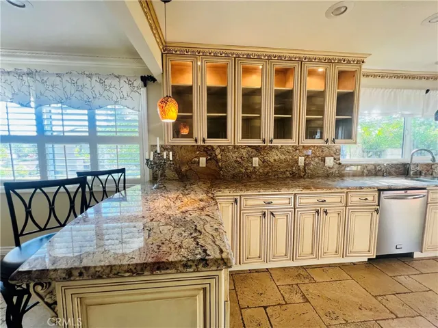 Kitchen, custom crown molding matching the cabinets.
