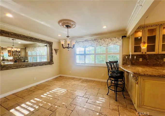 Dining room, with floor travertine, enlarged window, shutter.