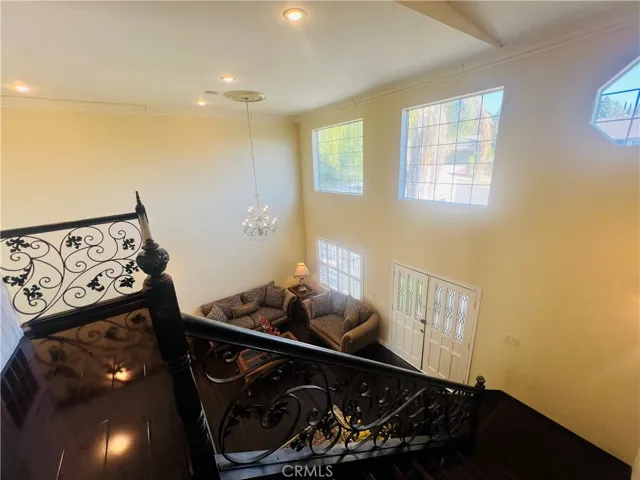 Staircase to the upper floor is made of Wrought Iron railings.
