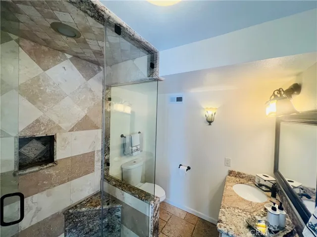 Bathroom downstairs for visitors, with a shower.