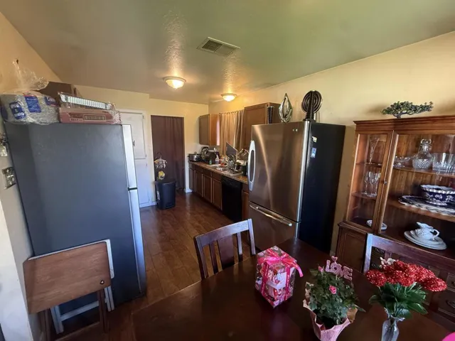 Dining room with dark wood-type flooring