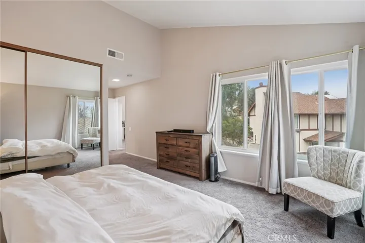 primary bedroom with lots of natural light