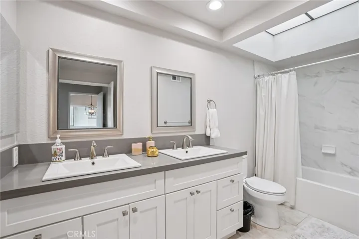 Primary bathroom with his and hers sinks.