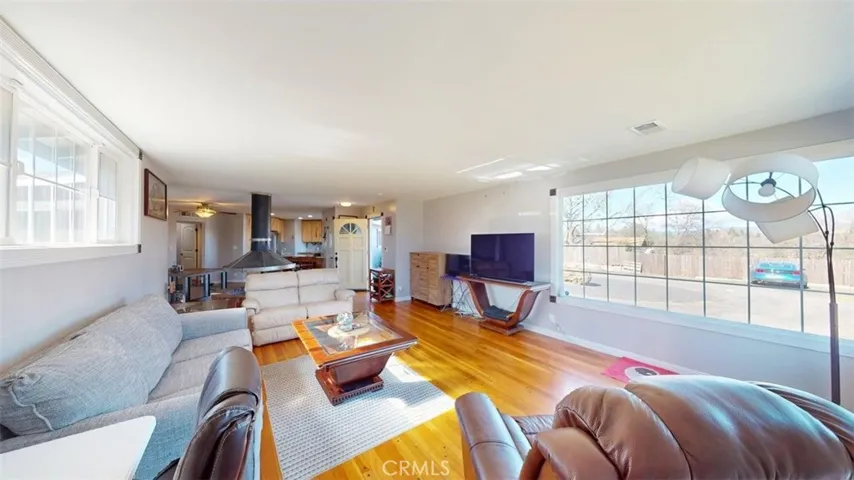 Living Room looking towards entry door and dining area