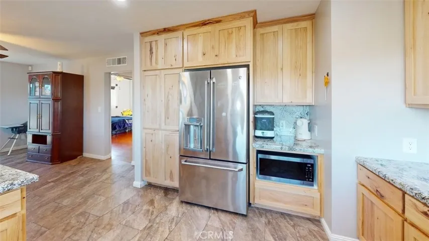 Kitchen looking towards hallway and bedroom 1
