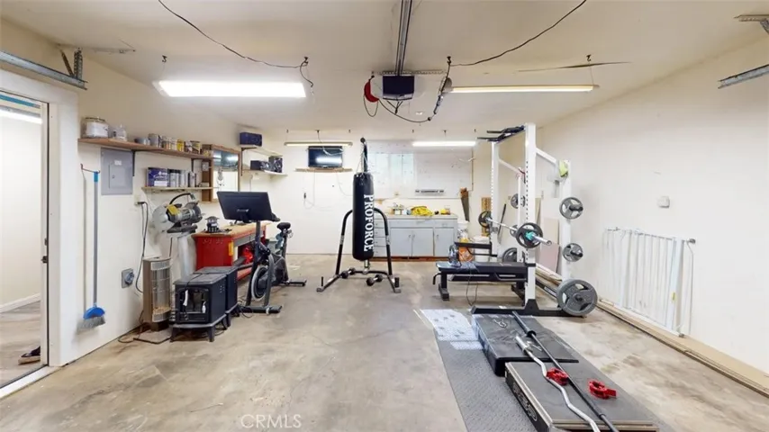 Garage standing in middle of 2 car garage door