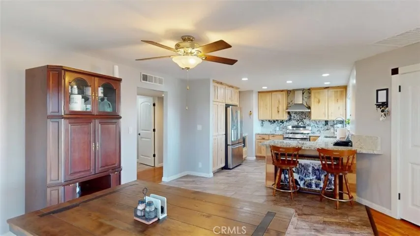 In dining area looking towards hall and kitchen