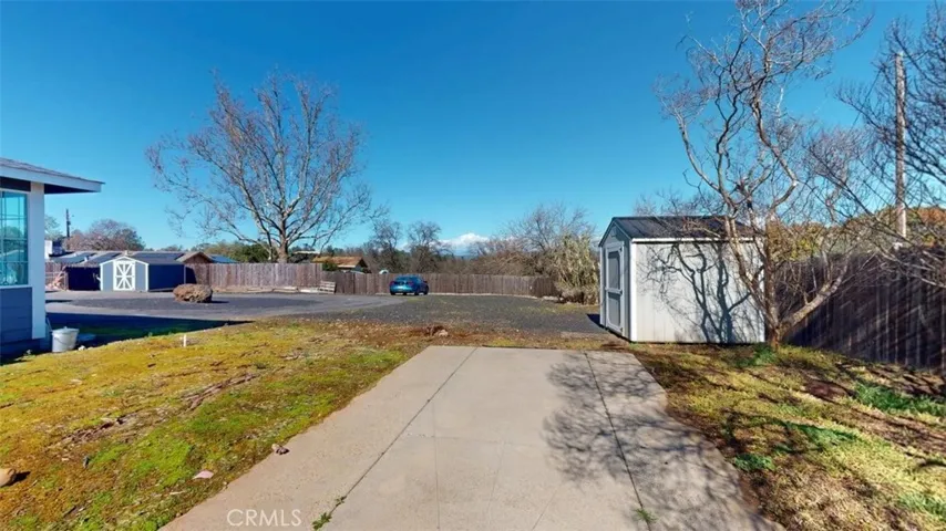 Standing on side yard cement area looking towards circle driveway