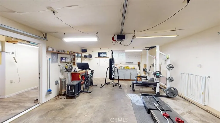 2 car attached garage currently used as a home gym