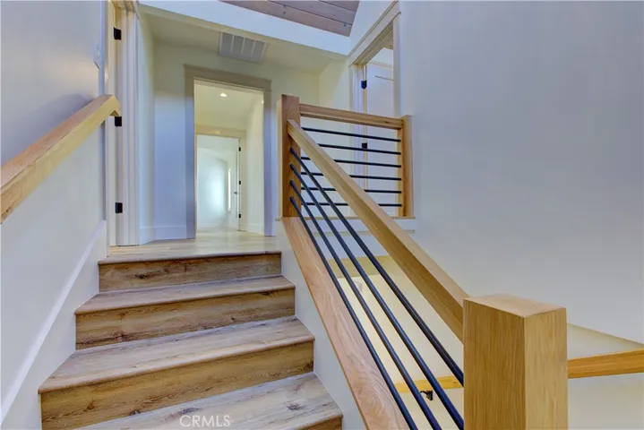 Staircase leading up to one of the Primary Suits.