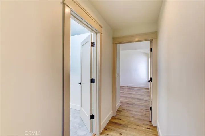 Upstairs hallway to primary suite and guest bedrooms.