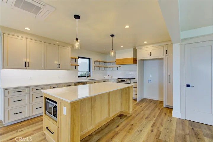 Kitchen counter tops Custom Island with built in microwave.