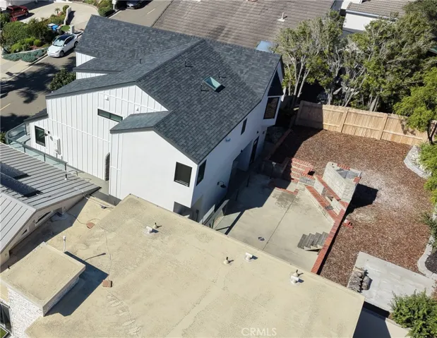 Aerial view: Side of House, Back yard, and Outdoor Fireplace.
